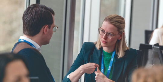 a man and a woman having a debrief following a talent assessment