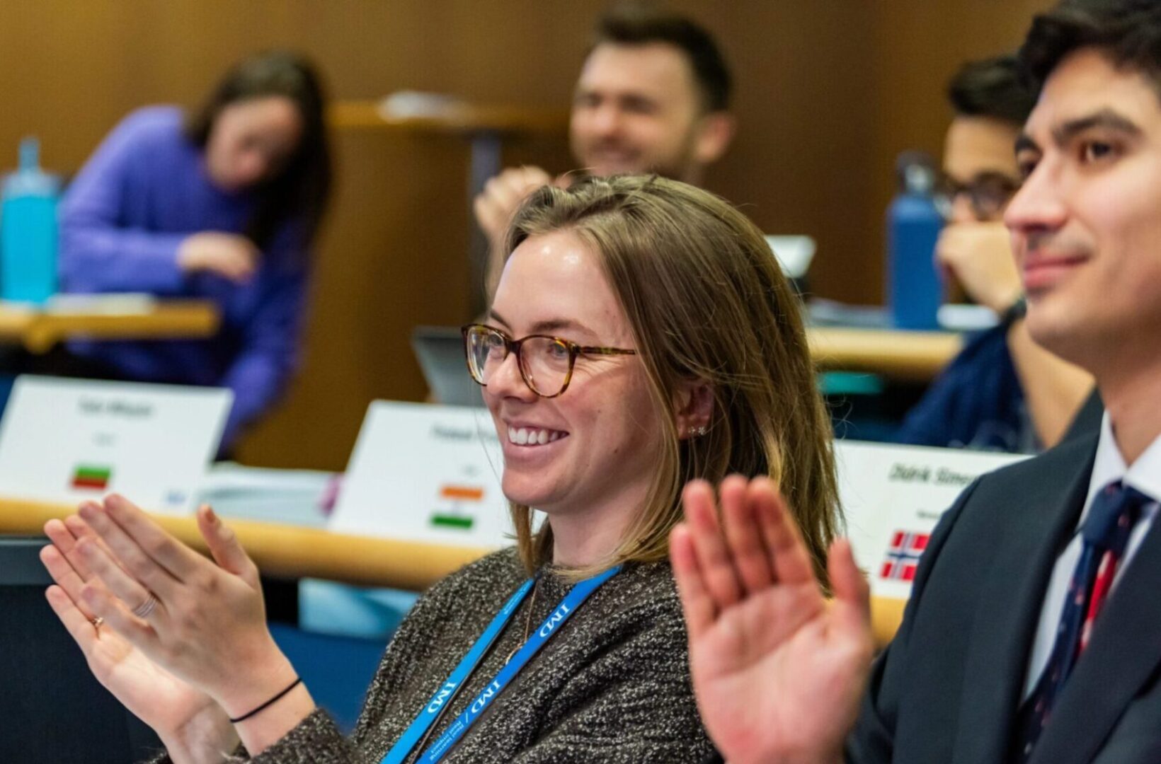 IMD MBA students clapping in a classroom