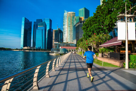 Healthy man running exercise in the morning in Marina Bay Sand park